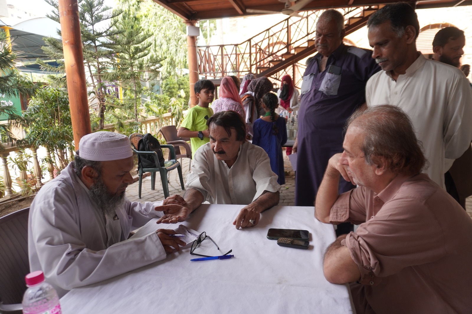 Medical experts from Hamdard University conducting free health checkups for journalists during the Eastern Medicine and Hijama camp at Karachi Press Club.