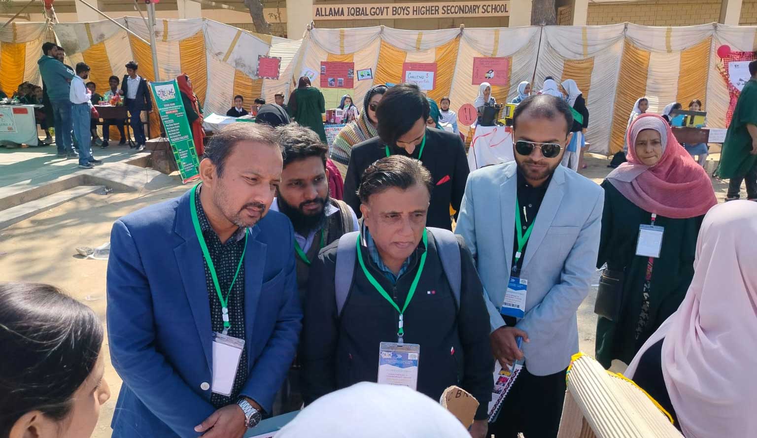 Judges including educationists and engineers evaluating student STEAM projects during STEAM Muqablo 2026 District Round at GBHSS Allama Iqbal, Karachi Central.