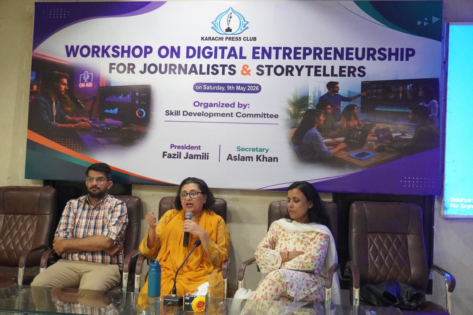 Panel discussion at Karachi Press Club with media professionals sharing entrepreneurial journeys and success stories.